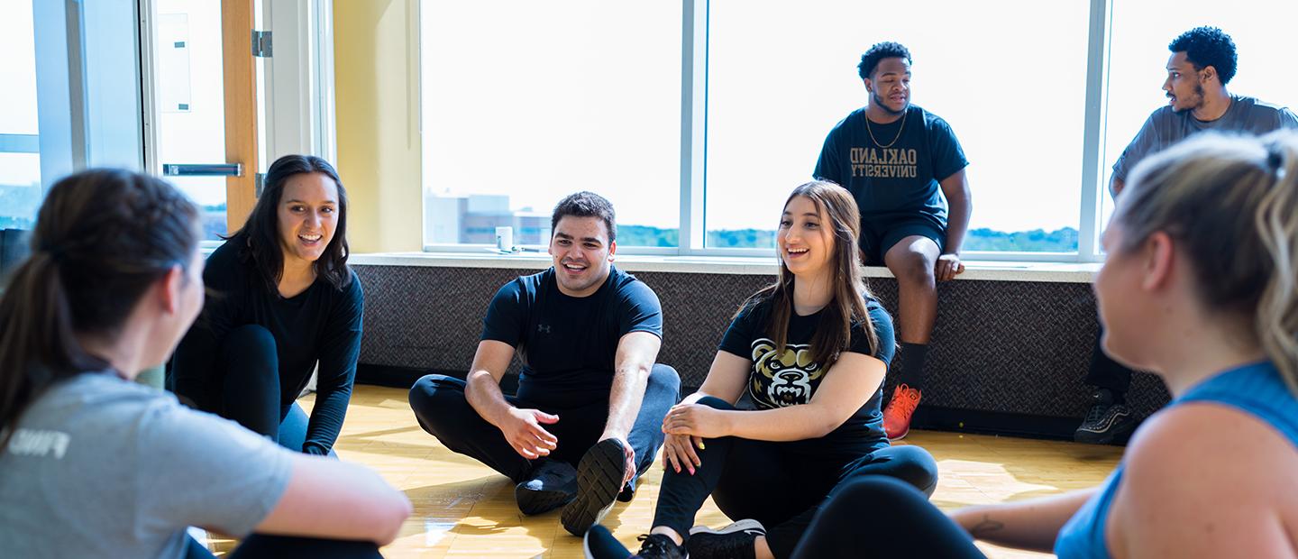 Students sitting in a circle talking